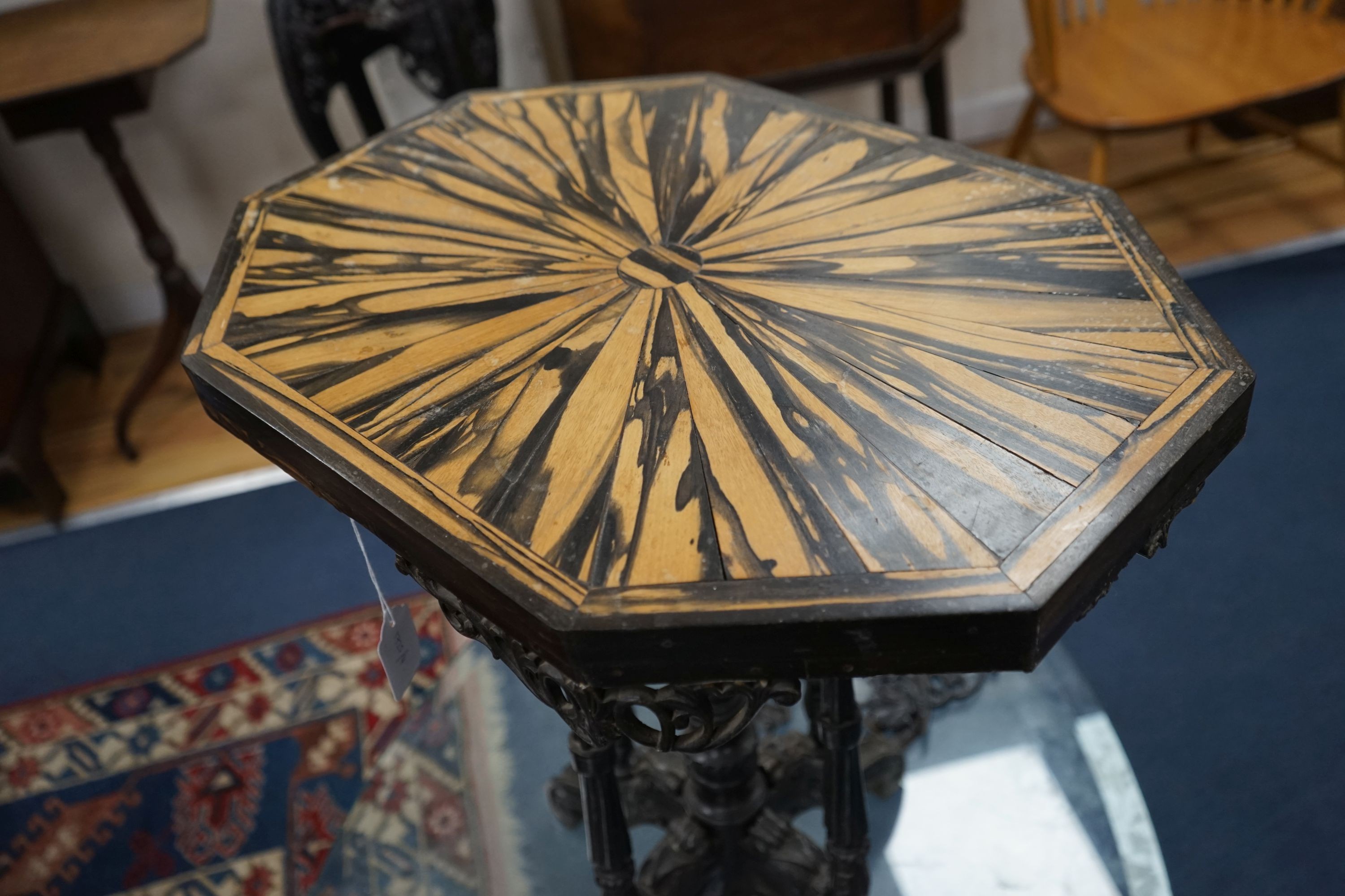 A 19th century Celanese carved ebony and coromandel veneered octagonal occasional table, width 57cm, depth 42cm, height 70cm